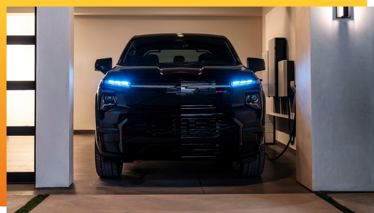 Black Chevy EV charging in garage