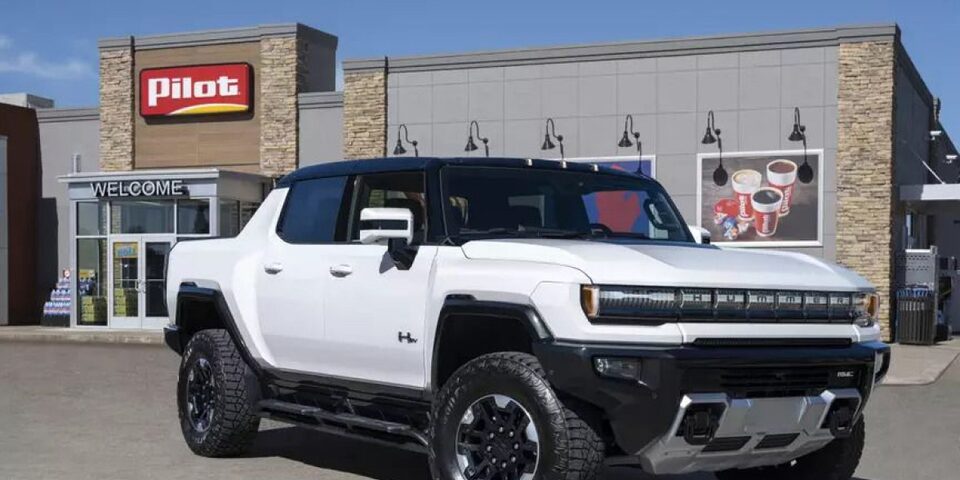 White Hummer EV in front of Pilot gas station.