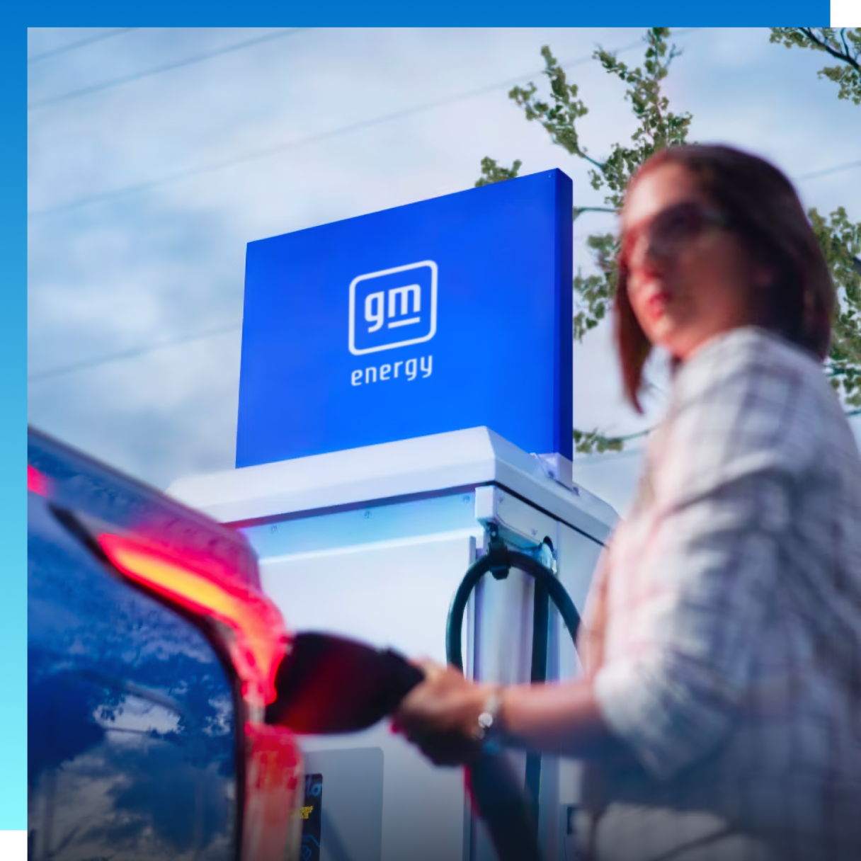 A woman at a public EV charging location