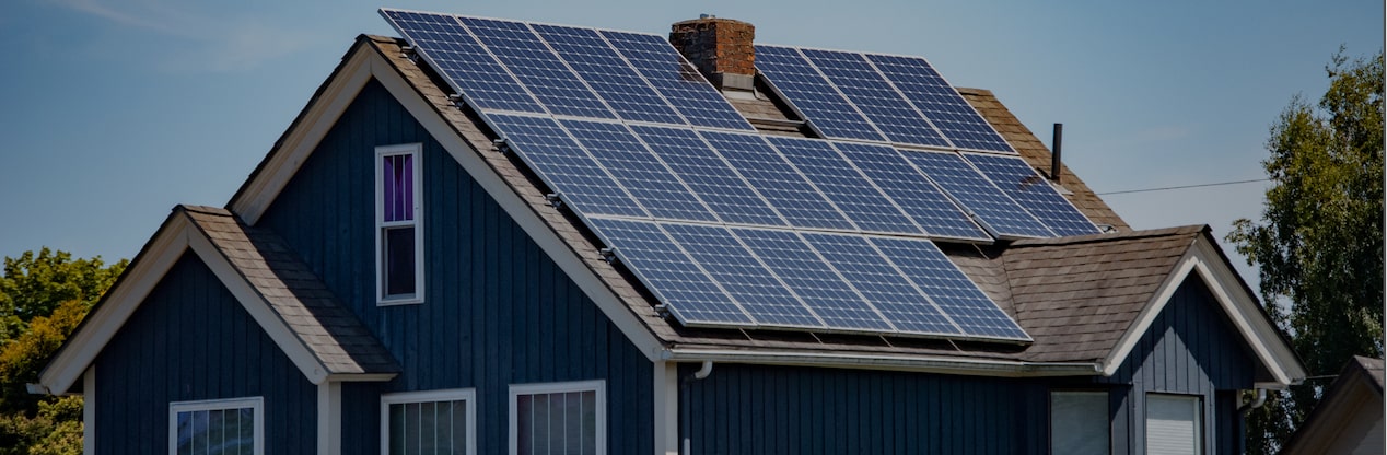 Blue house with solar panels