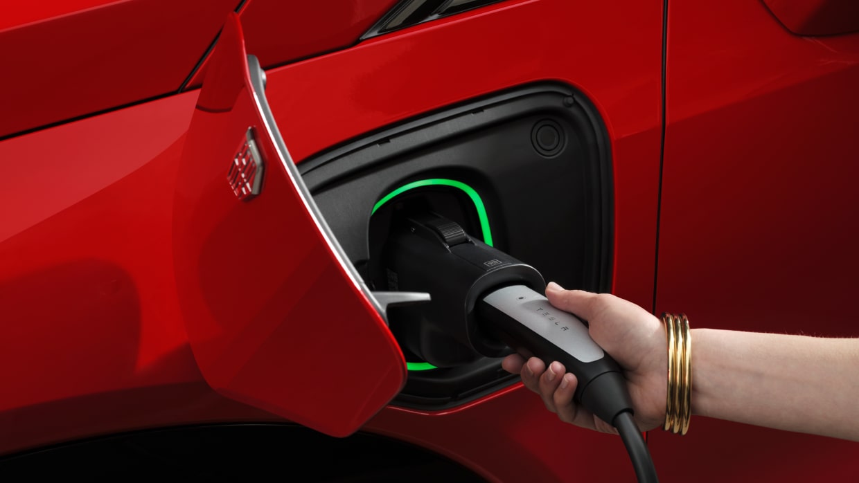 Upclose of phone with digital receipts from EV charging history