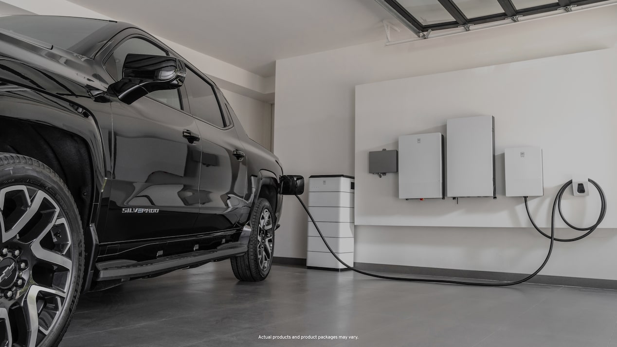 Black EV truck charging in garage charging station