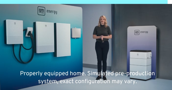 Woman standing in front of a suite of GM Energy products