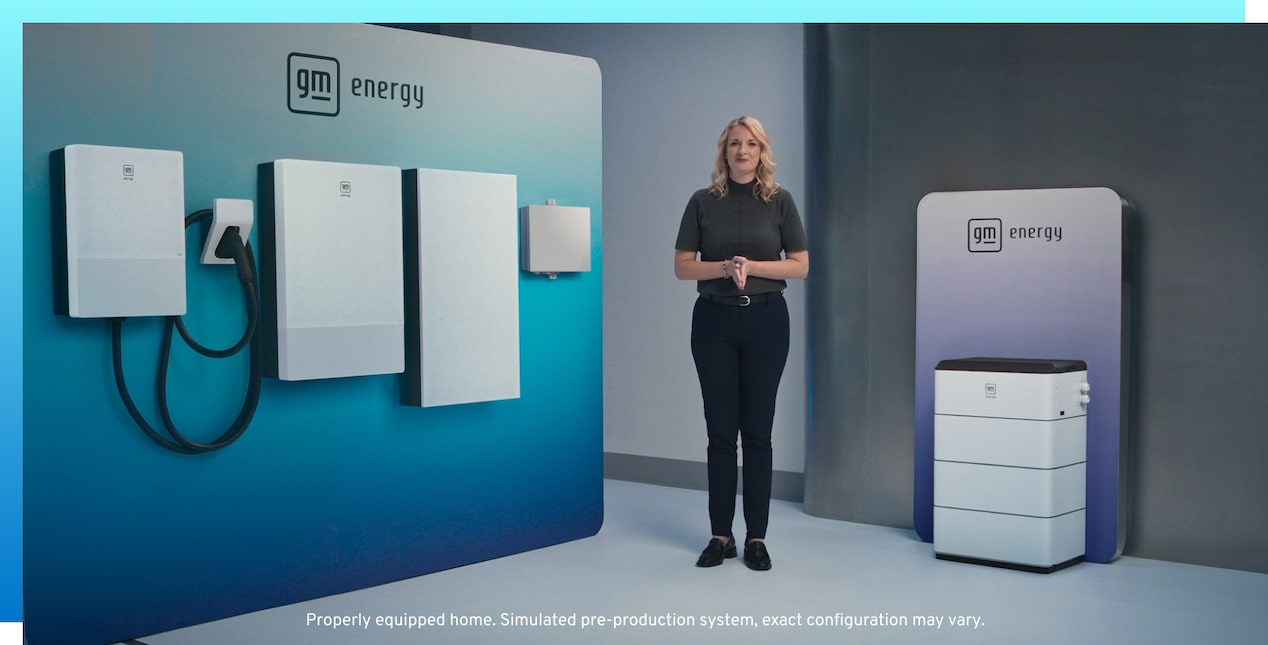 Woman standing in front of a suite of GM Energy products