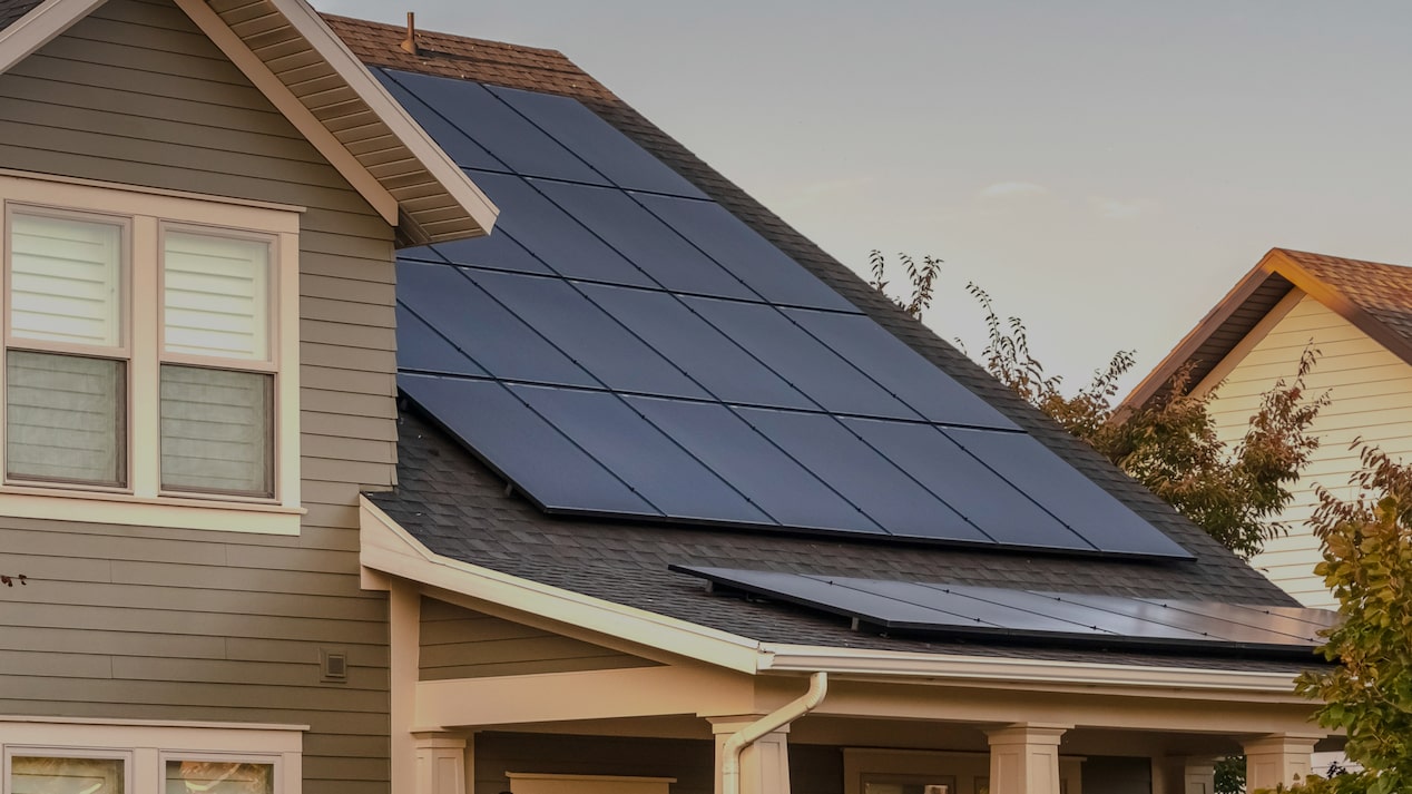 A two-story house with solar panels