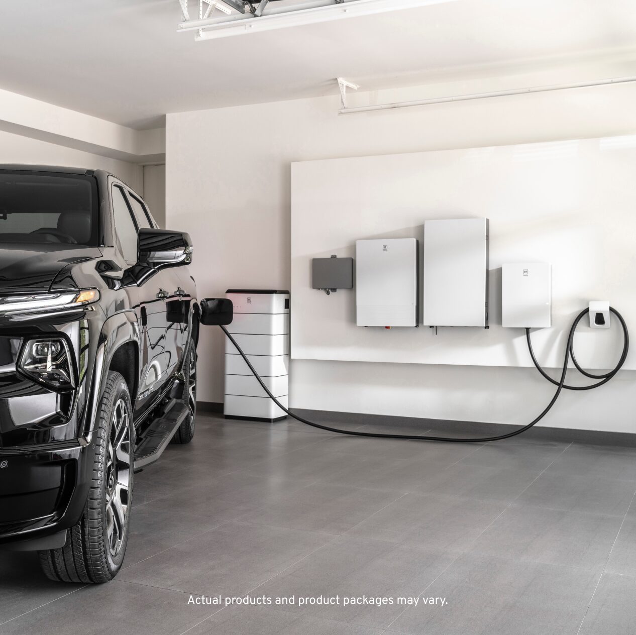 Black EV attached to wall charging station