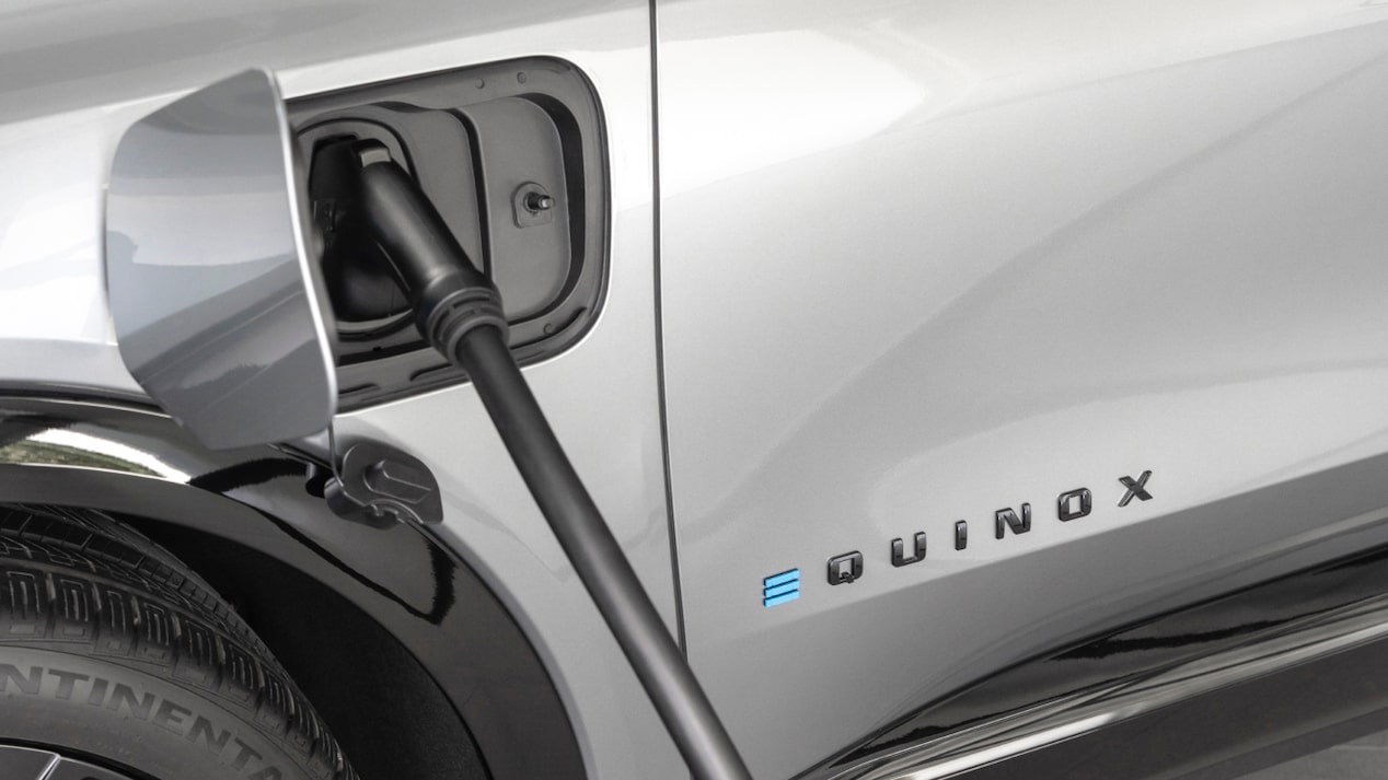 Equinox EV plugged into EV charger