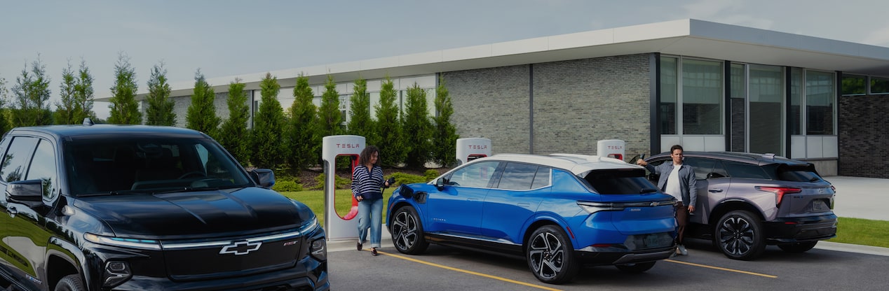 Three cars at charging station