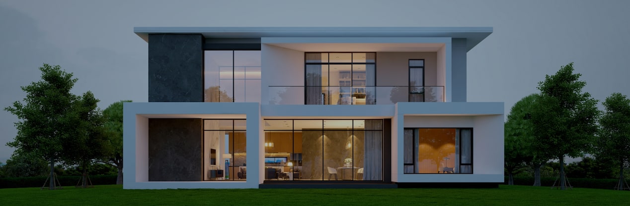 Modern home at dusk with interior lights turned on