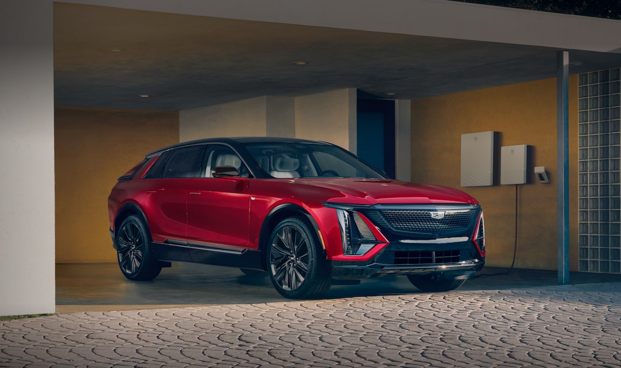 Red Cadillac LYRIQ EV parked in garage