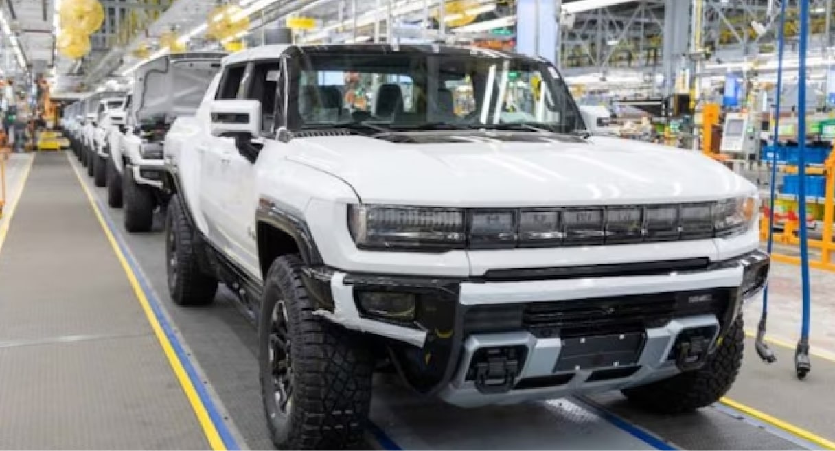 EV trucks on an assembly line