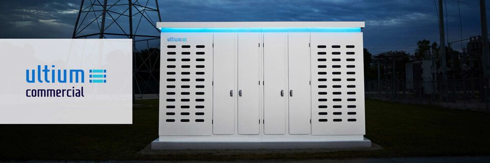 Close-up of an Ultium Commercial product at night with a blue glow, and the Ultium Commercial logo over the left side of the image.